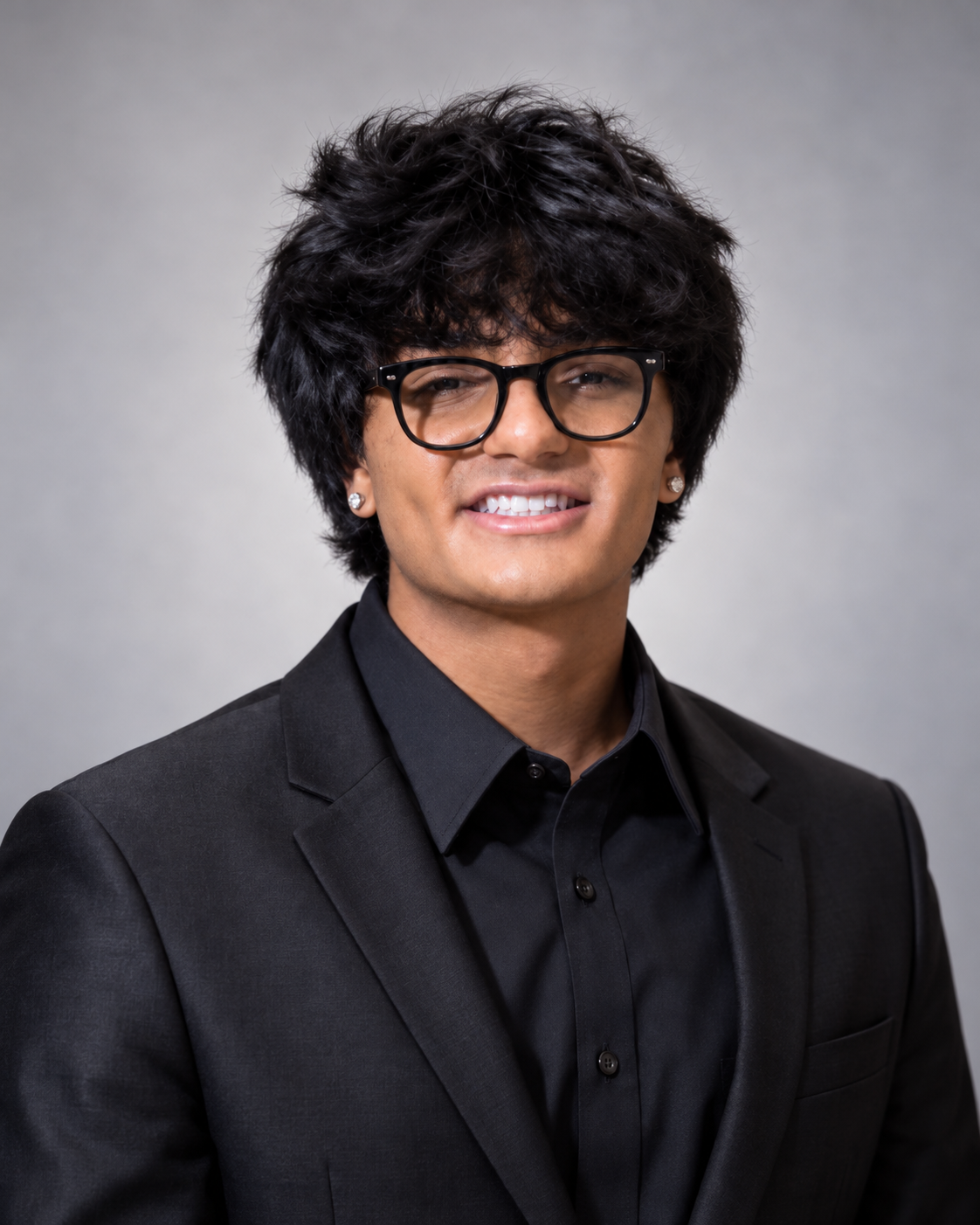 Aazim Charania, co-founder of TableSide, in a studio portrait wearing a black suit jacket