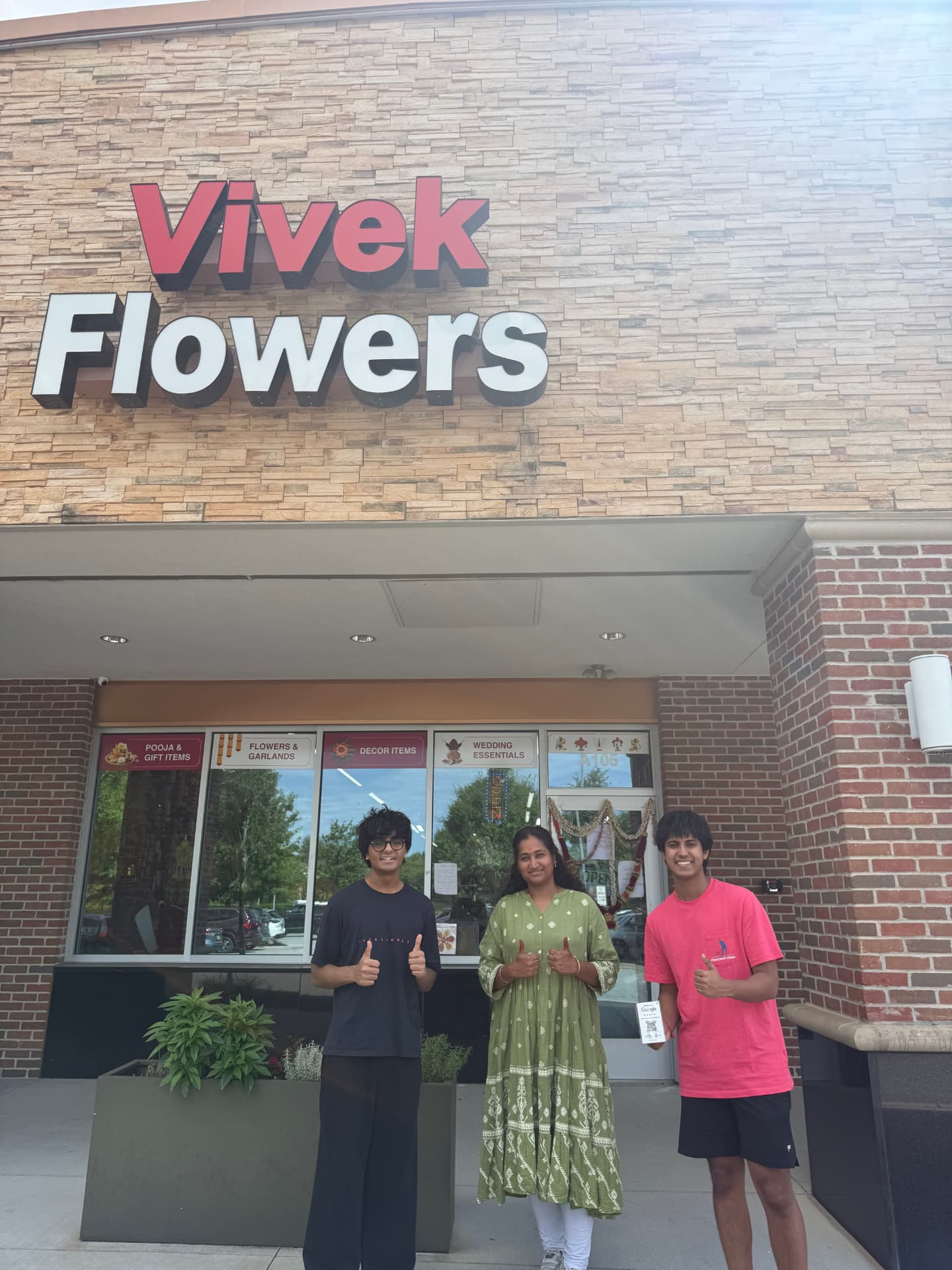 The TableSide team with the owners of Vivek Flowers in front of their storefront