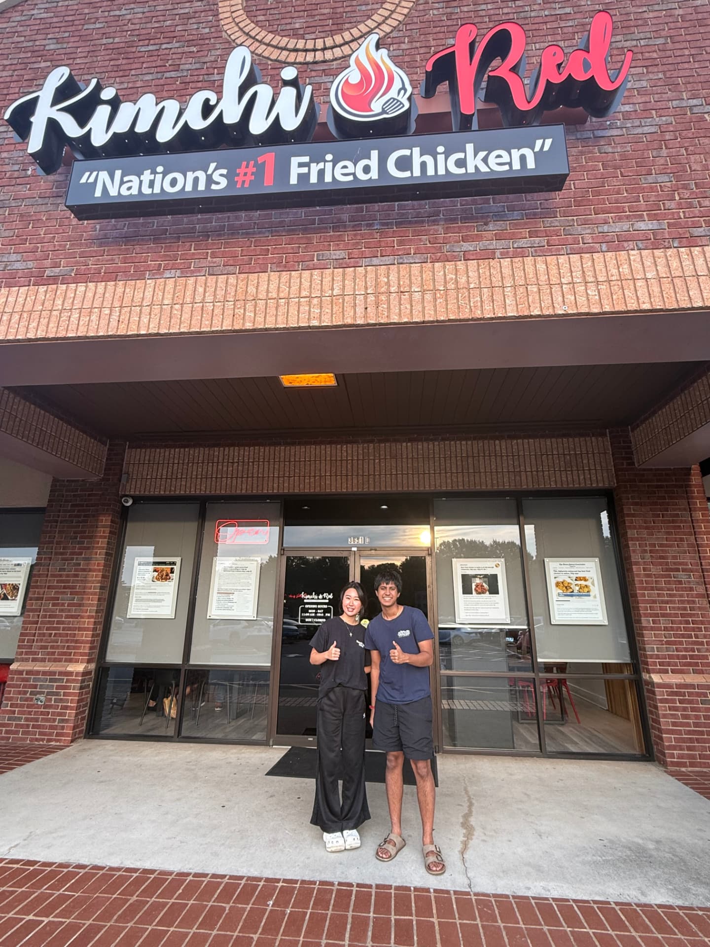 The TableSide team with the owner of Kimchi Red in front of their Alpharetta restaurant